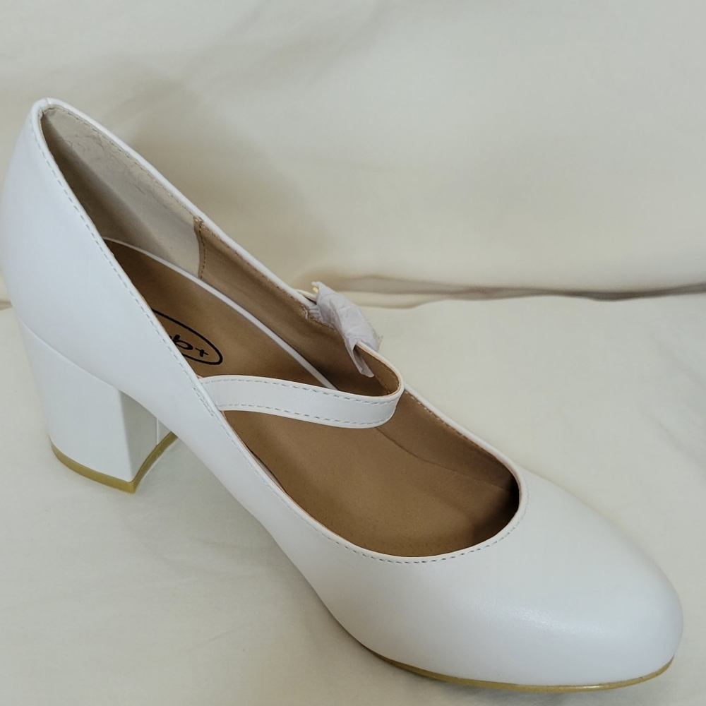 White Mary Jane style 3 inch heels. Partially worn.